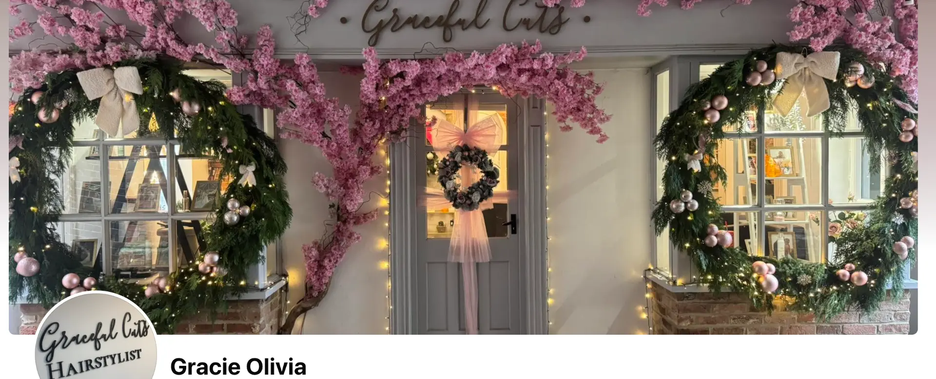 The salon front dressed with Christmas wreaths and fairy lights